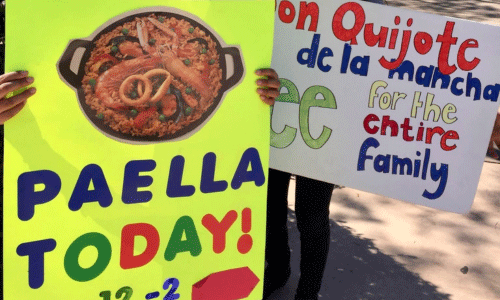Signs of Paella and Cervantes Festival to inform people about the event celebrating Alcala de Henares, Spain.